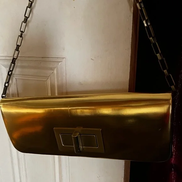 NWT - Olga berg gold clutch bag. NWT. Comes with chain strap. Rectangular clasp. - Picture 11 of 15